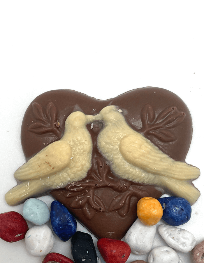 Milk chocolate heart with white chocolate lovebirds.